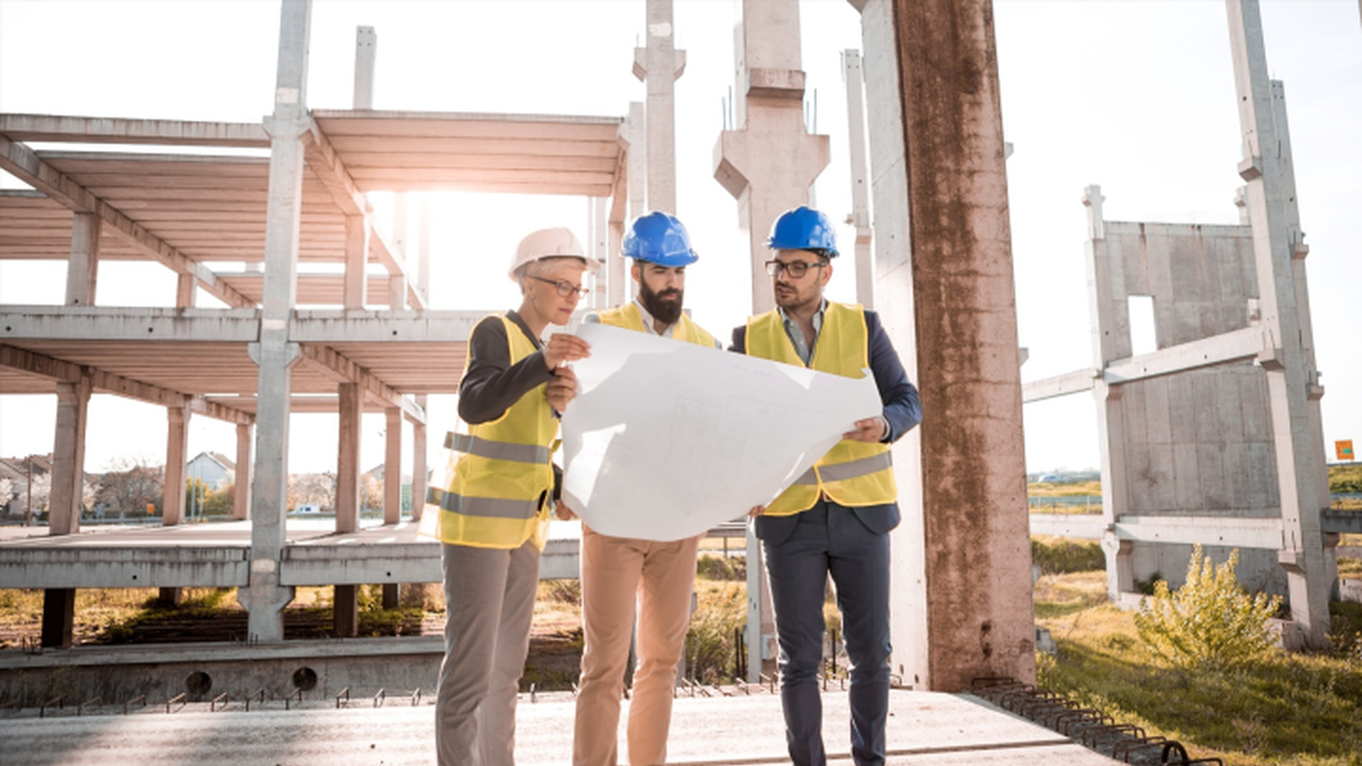 People looking at a blueprint