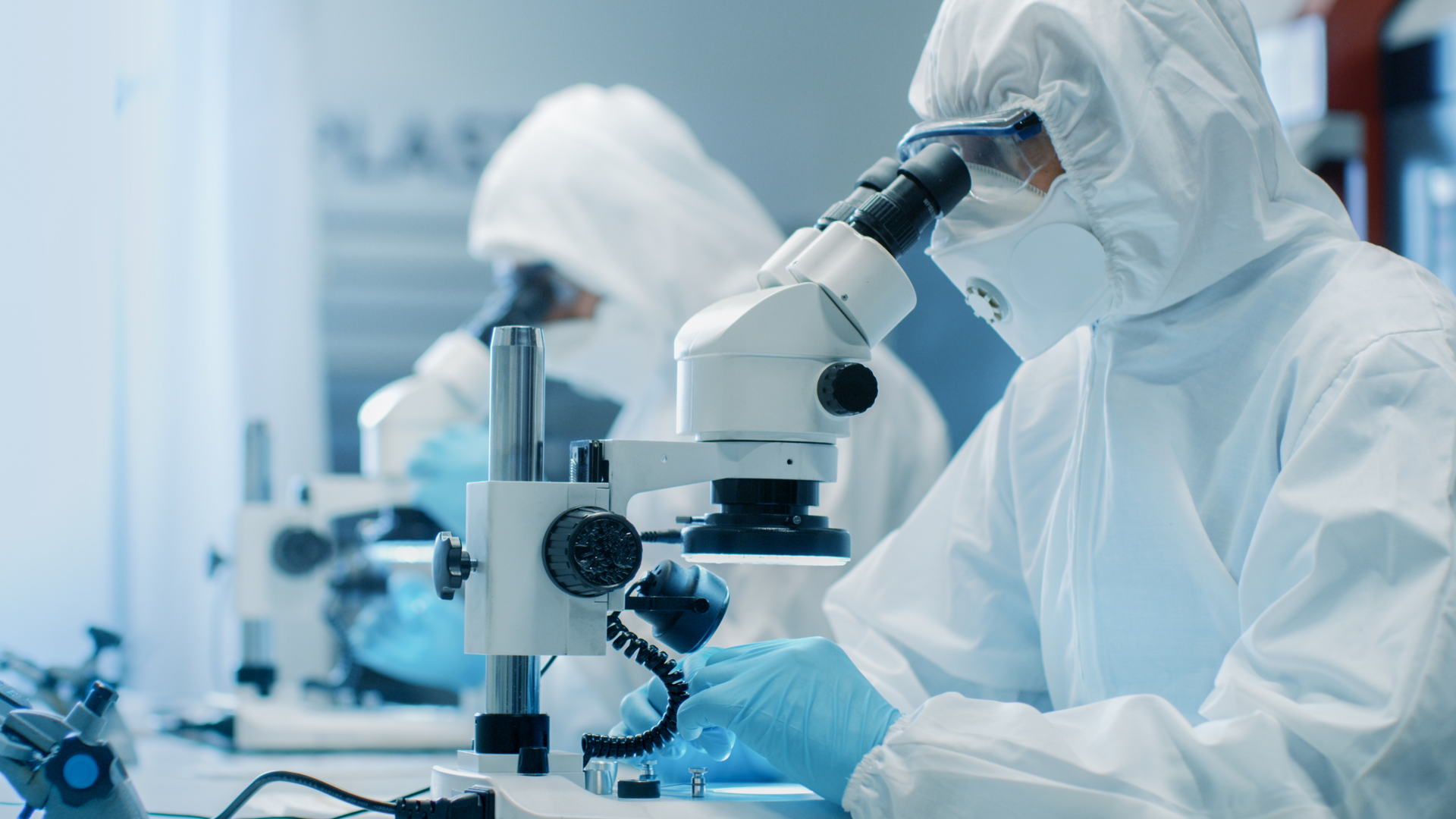 Scientists using lab equipment